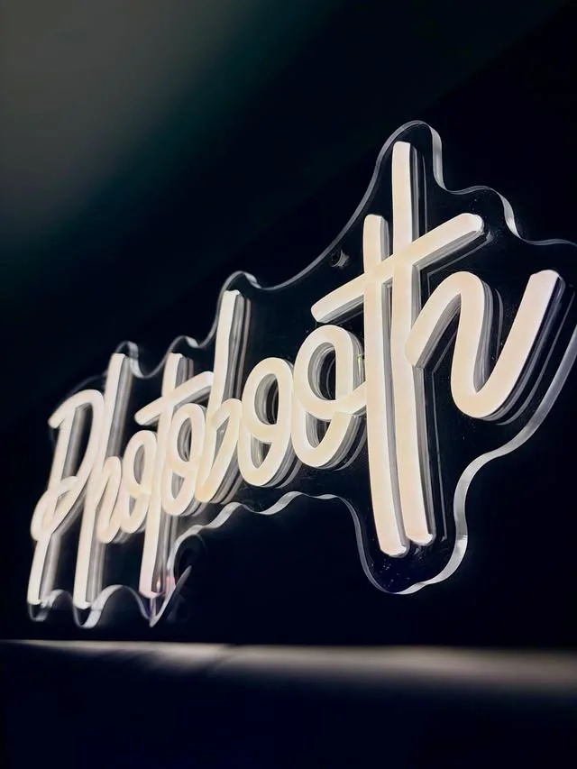 Close view of the illuminated Photobooth sign at Maggie May's