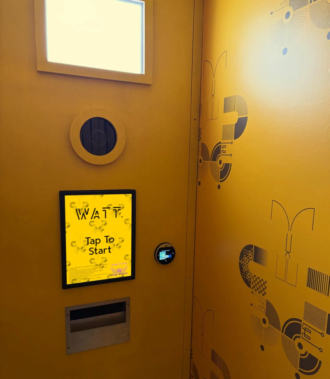 Watt Bar photobooth interior with venue-branded touchscreen
