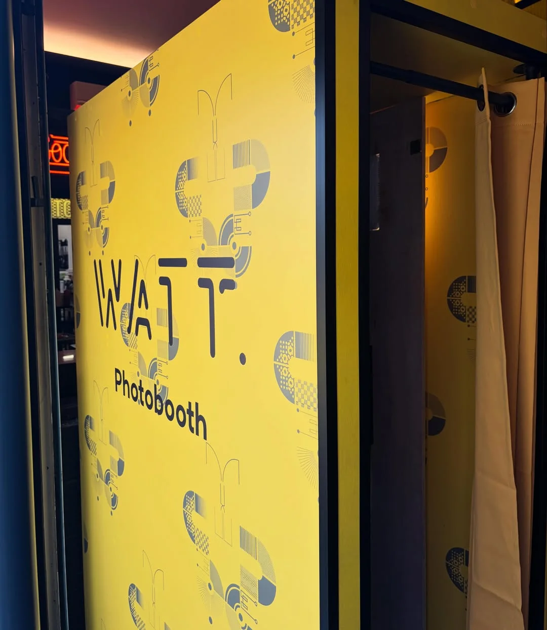 Watt Bar branding applied across the booth exterior